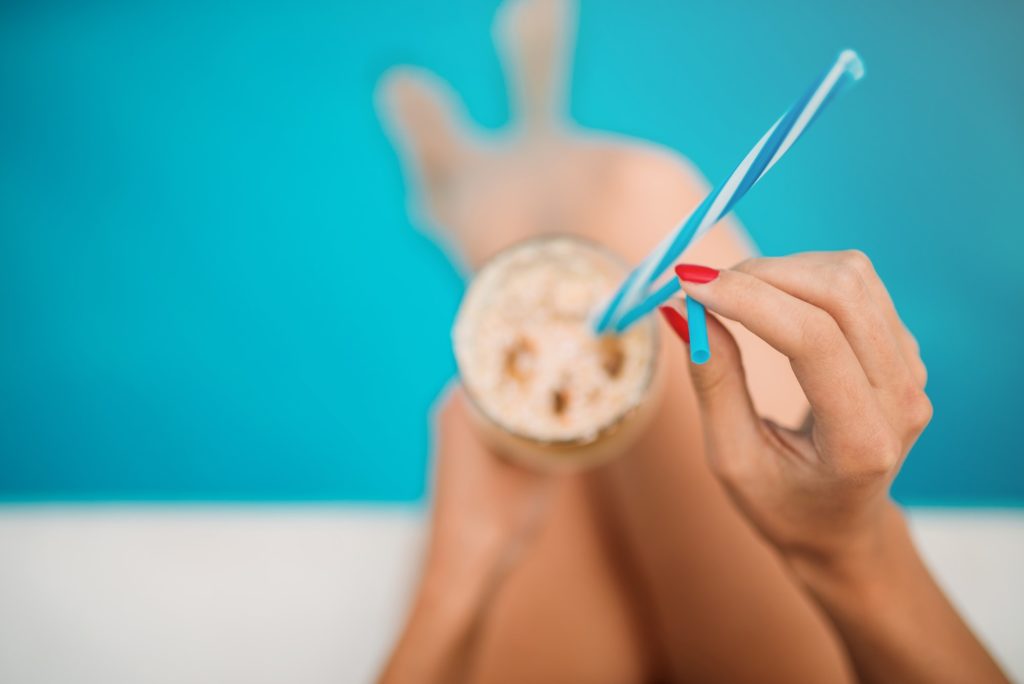 Female person hands with summer cocktail