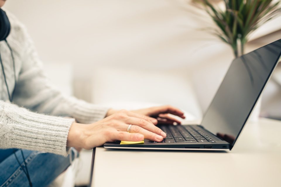 Woman working from home on laptop computer
