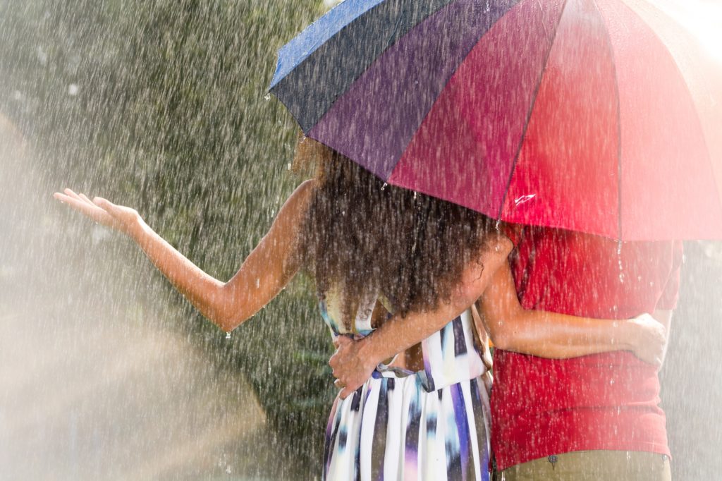 Man and woman under umbrella