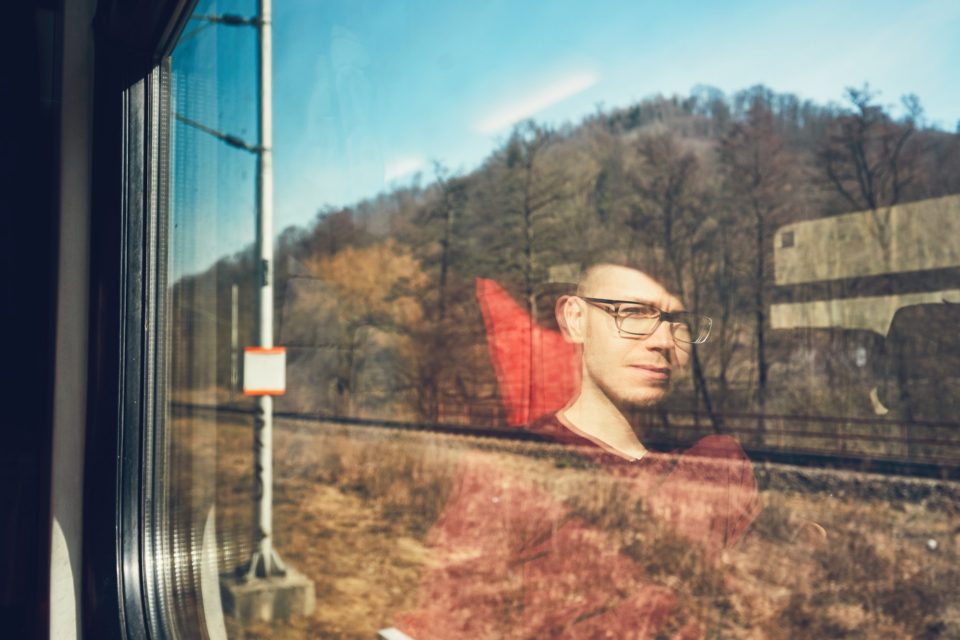 Young man traveling by train