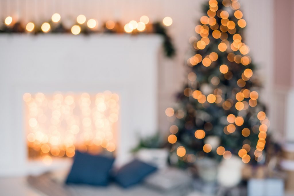 Blurred christmas background with fireplace and christmas tree
