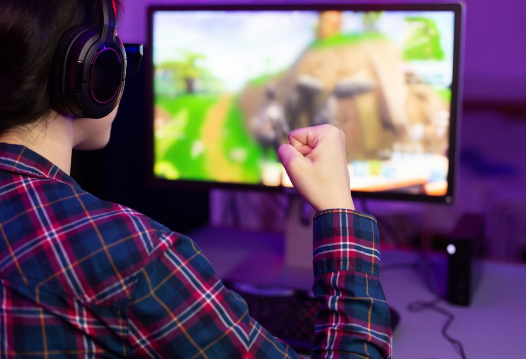 Female gamer winning in online video game