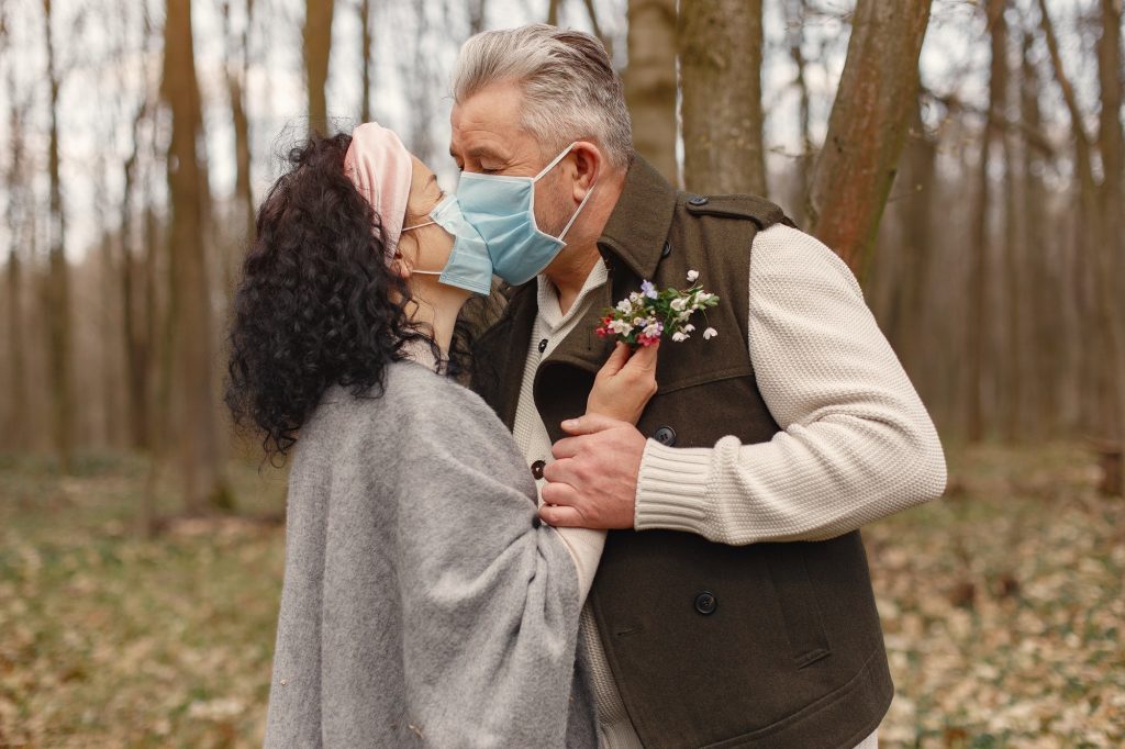 Elegant adult couple in a spring forest