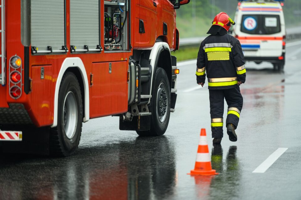Highway Traffic Accident Site Firefighter Securing Traffic