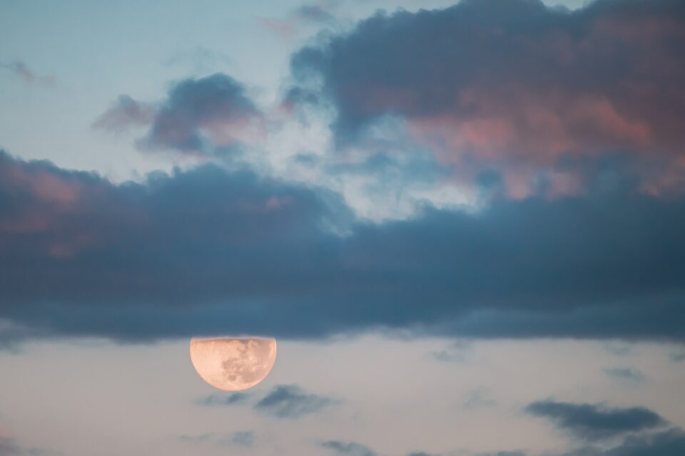 Full Moon Rising In Cloudy Evening Sky