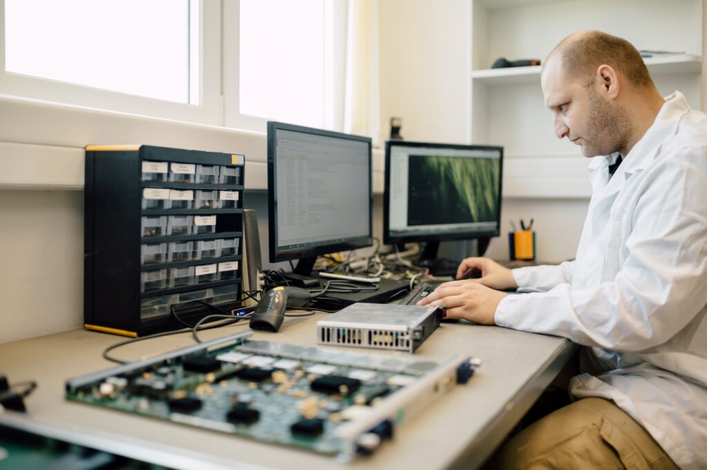 Technician repairing cmts cards