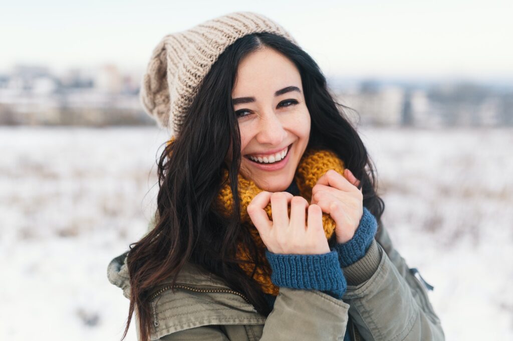 Heart melting winter portrait of pretty young woman awaiting Chr