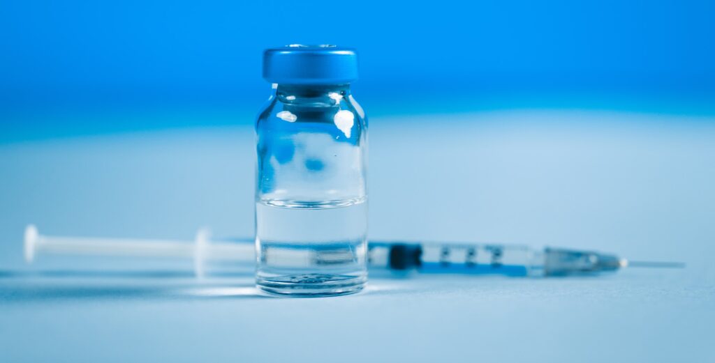 Syringe with vaccine for Covid-19, Coronavirus