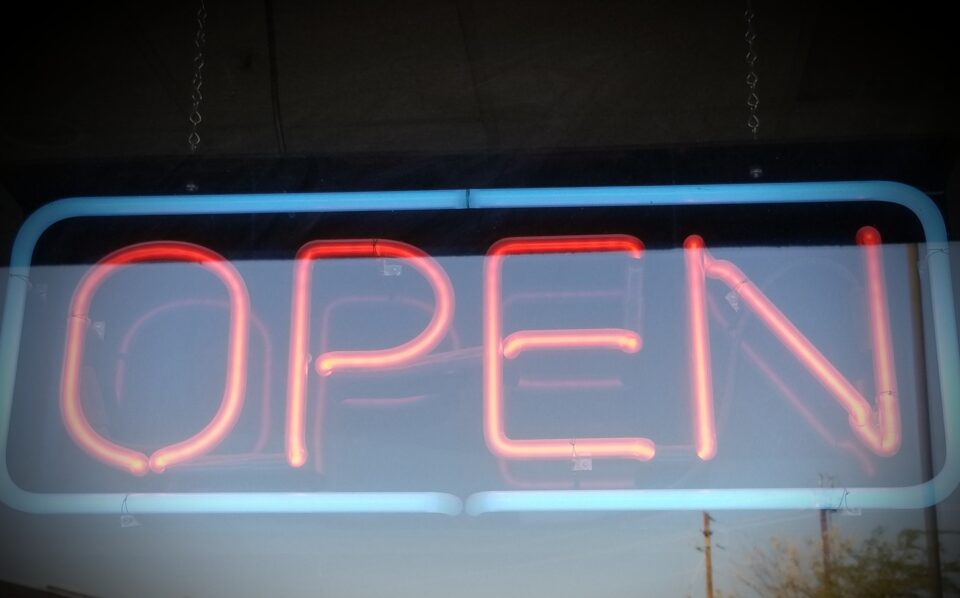 OPEN! Neon OPEN sign in a take out food restaurant.