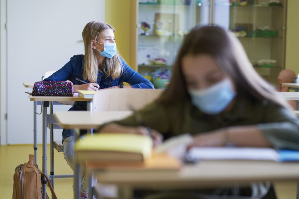 Schoolgirls learning in the classroom during a pandemic