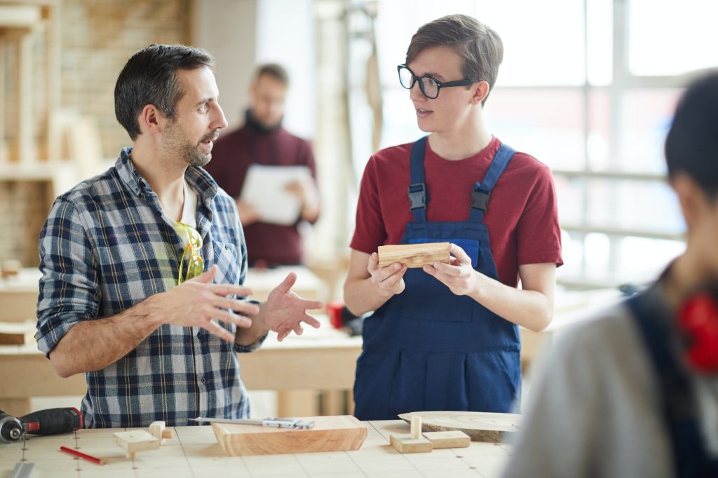 Carpenter Talking to Apprentice