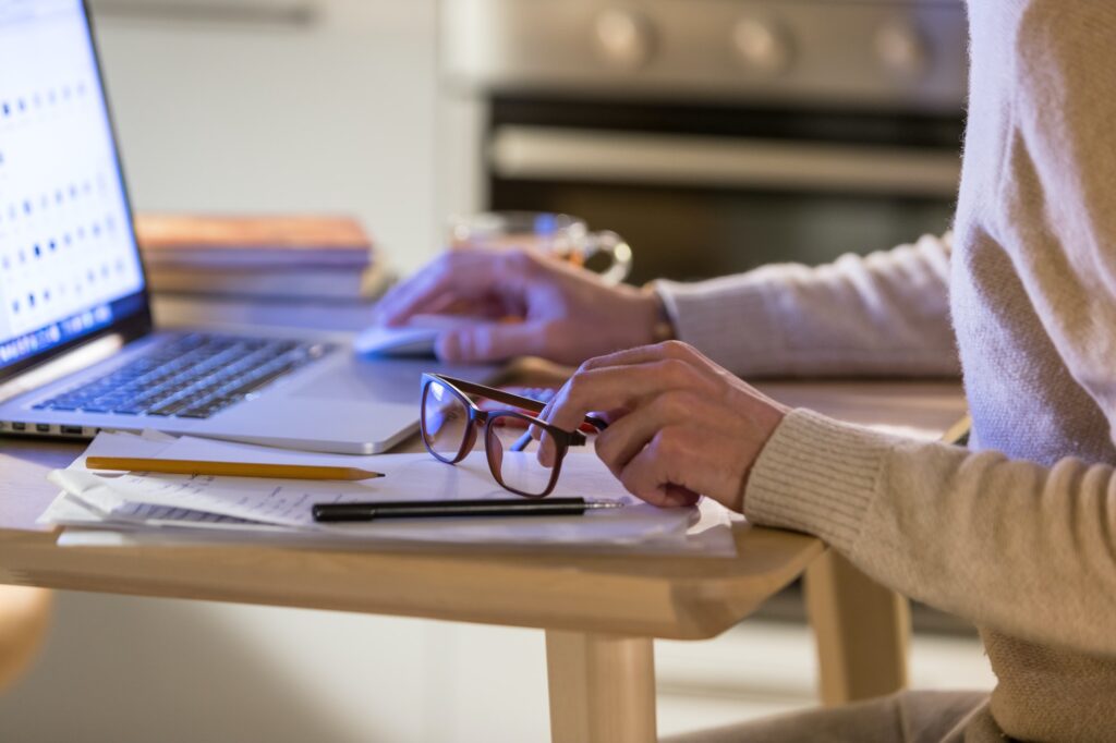 Man freelancer working at home office on laptop. Distance job, remote online work