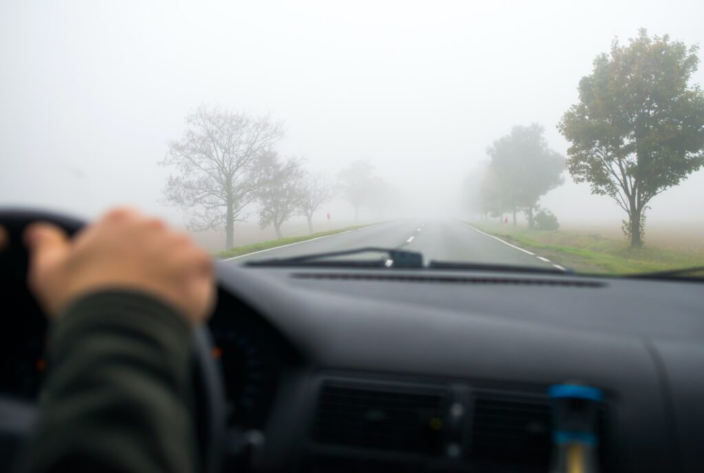 Car driving in the Fog Road