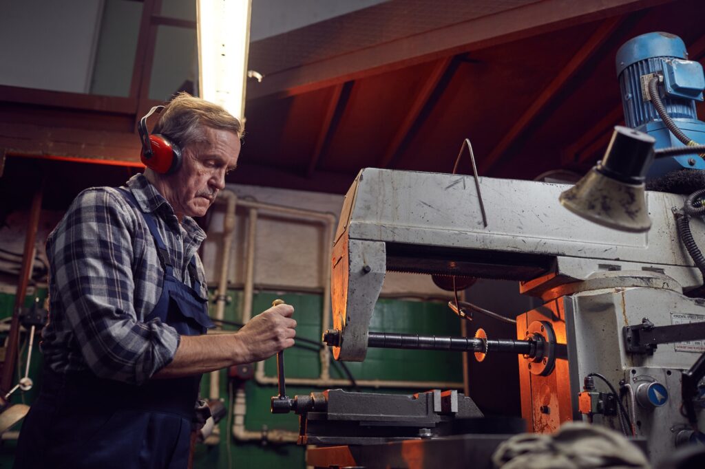 Operator working on lathe