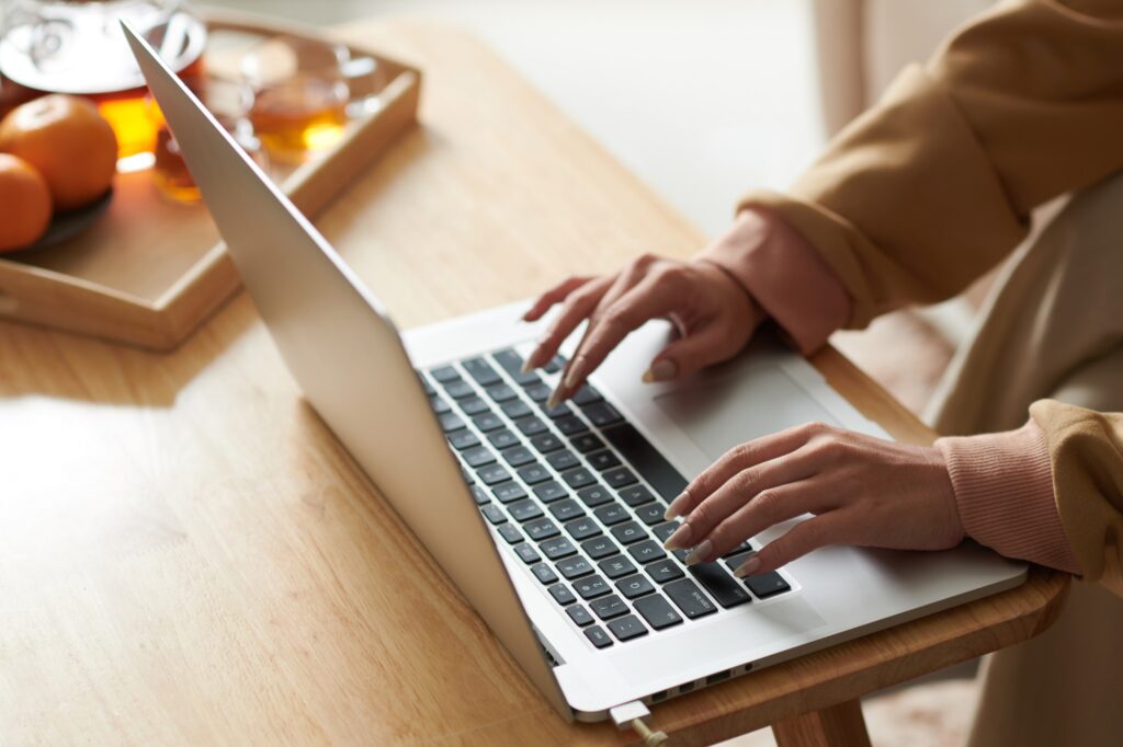 Woman working on laptop online