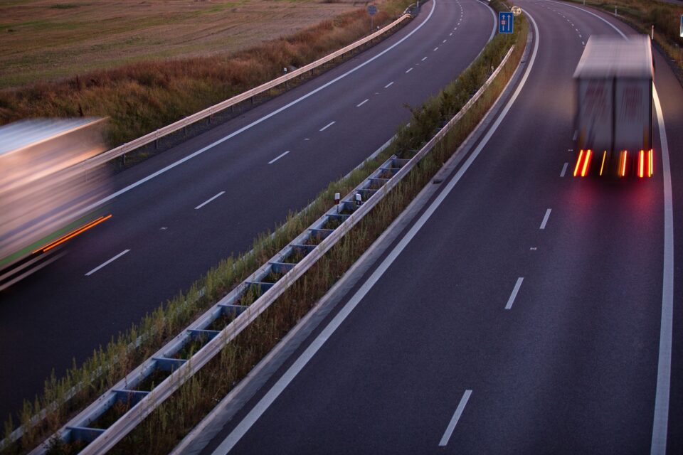 highway traffic - motion blurred truck on a highway/motorway/spe